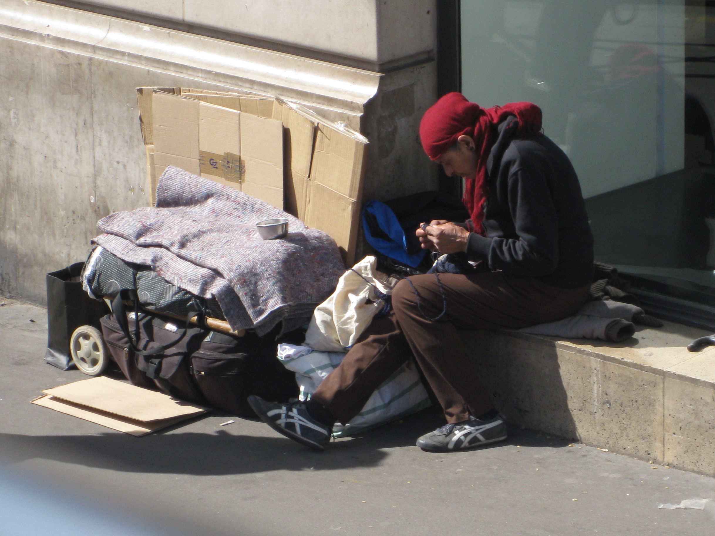 A beggar preparing for the morning.